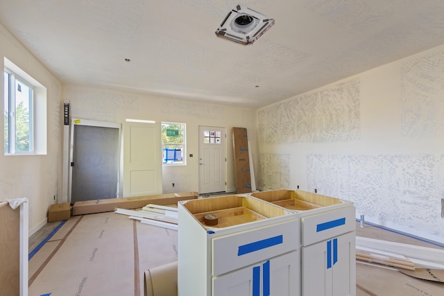 1324 W Dalke Ave Unit B, Spokane, WA 99205 - kitchen with a center island and white cabinetry