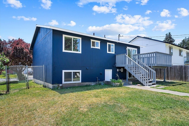 4129 E 32nd Ave, Spokane, WA 99223 - back of property with a gate, stairs, and a wooden deck
