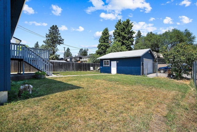 4129 E 32nd Ave, Spokane, WA 99223 - view of yard featuring a garage, an outbuilding, and stairs
