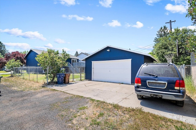 4129 E 32nd Ave, Spokane, WA 99223 - view of front of home featuring a detached garage and an outbuilding