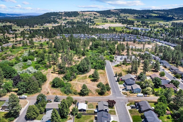 4129 E 32nd Ave, Spokane, WA 99223 - aerial view of property and surrounding area featuring nearby suburban area and a mountain backdrop