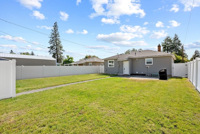 5204 N Maple St, Spokane, WA 99205 - back of property with a fenced backyard, a gate, a chimney, and a patio area