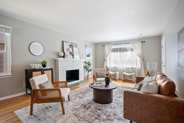 5204 N Maple St, Spokane, WA 99205 - living room with wood finished floors and a brick fireplace