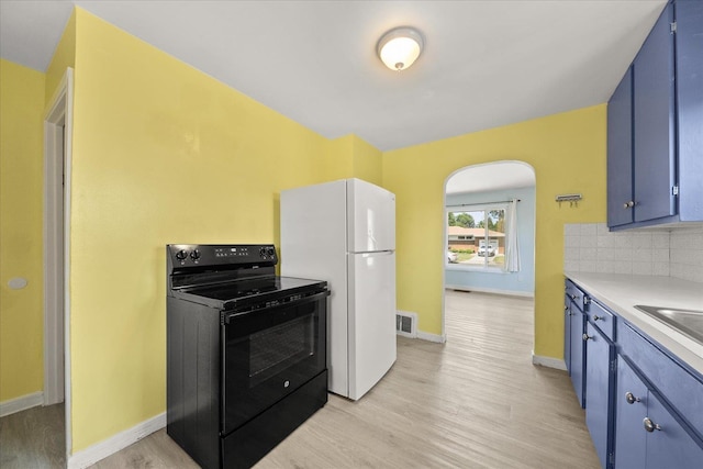 3829 W Broad Ave, Spokane, WA 99205 - kitchen featuring black range with electric cooktop, freestanding refrigerator, blue cabinets, light wood-style floors, and light countertops