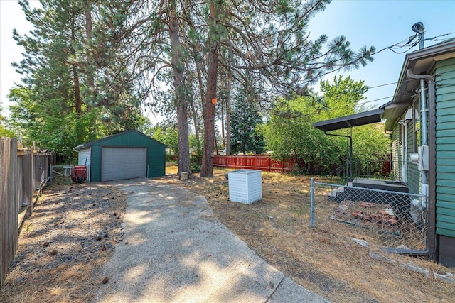 3829 W Broad Ave, Spokane, WA 99205 - view of yard with driveway, an outdoor structure, and a detached garage