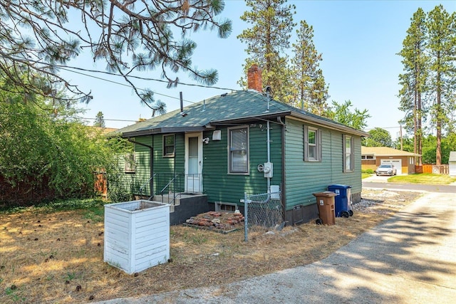 3829 W Broad Ave, Spokane, WA 99205 - view of front facade featuring a chimney and an outbuilding