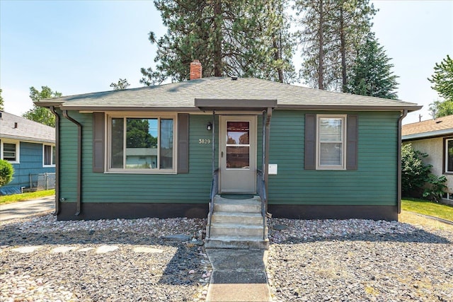 3829 W Broad Ave, Spokane, WA 99205 - view of front of house featuring a chimney and entry steps