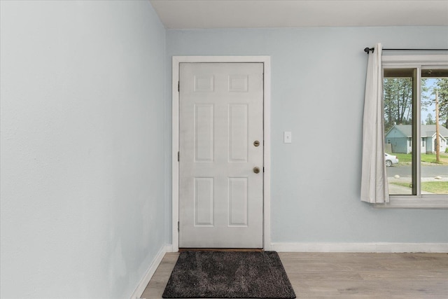 3829 W Broad Ave, Spokane, WA 99205 - doorway to outside with wood finished floors and baseboards