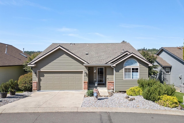 2106 E Turnberry Ln, Spokane, WA 99223 - single story home with brick siding, a garage, driveway, and a shingled roof
