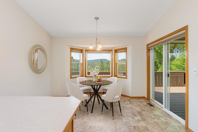 2106 E Turnberry Ln, Spokane, WA 99223 - dining space featuring stone finish flooring and a chandelier