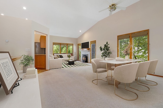 2106 E Turnberry Ln, Spokane, WA 99223 - dining room with a glass covered fireplace, plenty of natural light, light carpet, recessed lighting, and high vaulted ceiling