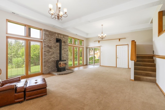 2106 E Turnberry Ln, Spokane, WA 99223 - carpeted living area featuring a chandelier, a wood stove, and stairs