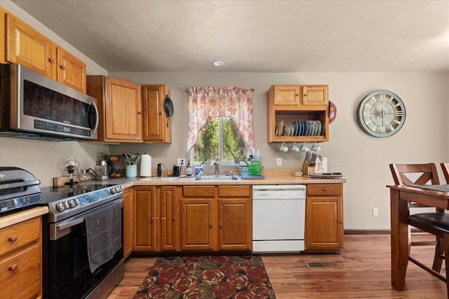 1481 Northshore Diamond Lake Rd, Newport, WA 99156 - kitchen with stainless steel appliances, light countertops, and dark wood-style flooring