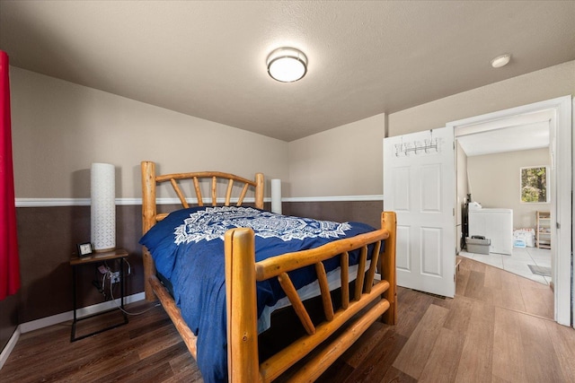 1481 Northshore Diamond Lake Rd, Newport, WA 99156 - bedroom featuring wood finished floors and washer / dryer