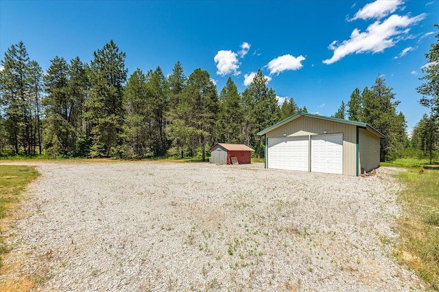 1481 Northshore Diamond Lake Rd, Newport, WA 99156 - detached garage featuring a wooded view