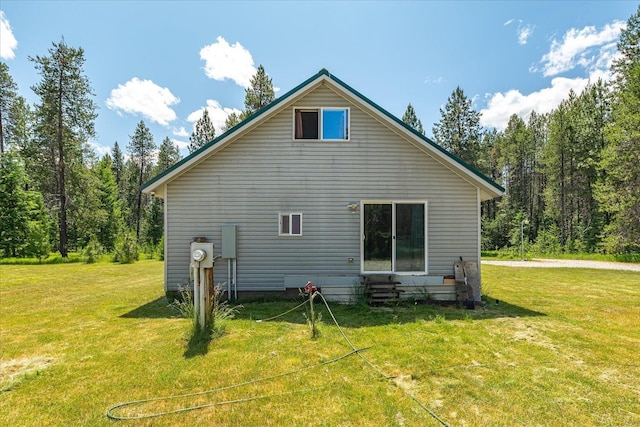 1481 Northshore Diamond Lake Rd, Newport, WA 99156 - rear view of house featuring entry steps, a yard, and a wooded view