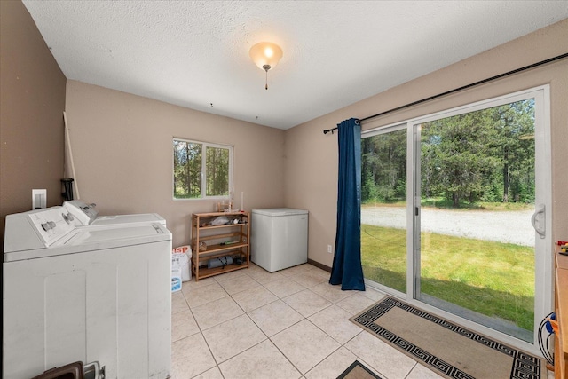 1481 Northshore Diamond Lake Rd, Newport, WA 99156 - laundry room featuring washing machine and dryer and light tile patterned floors