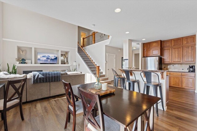 4213 S Cook St, Spokane, WA 99223 - dining room featuring wood finished floors, stairs, and recessed lighting