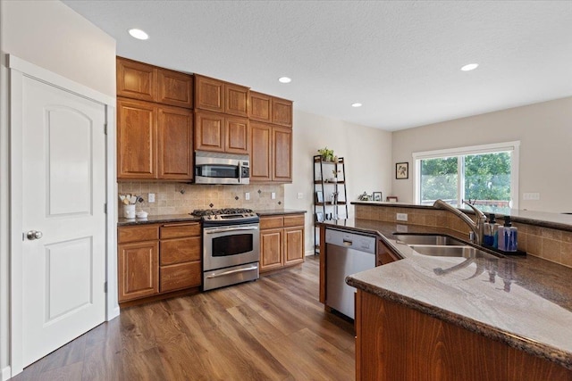 4213 S Cook St, Spokane, WA 99223 - kitchen featuring stainless steel appliances, tasteful backsplash, dark wood-style flooring, and recessed lighting