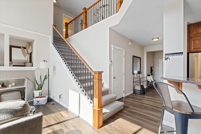 4213 S Cook St, Spokane, WA 99223 - stairs featuring wood finished floors and a towering ceiling