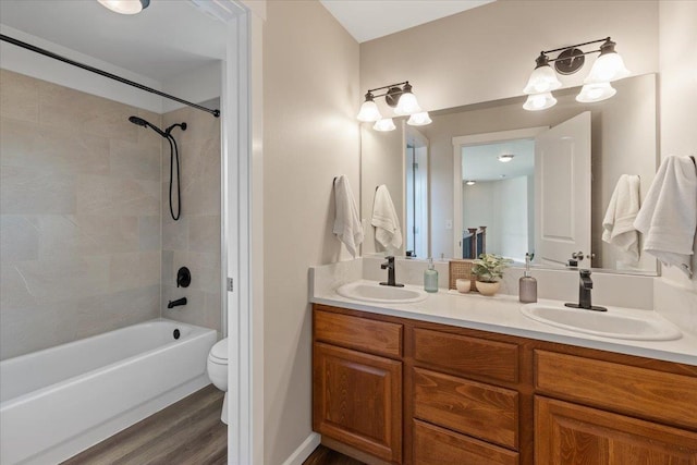 4213 S Cook St, Spokane, WA 99223 - full bathroom with double vanity, wood finished floors, and washtub / shower combination
