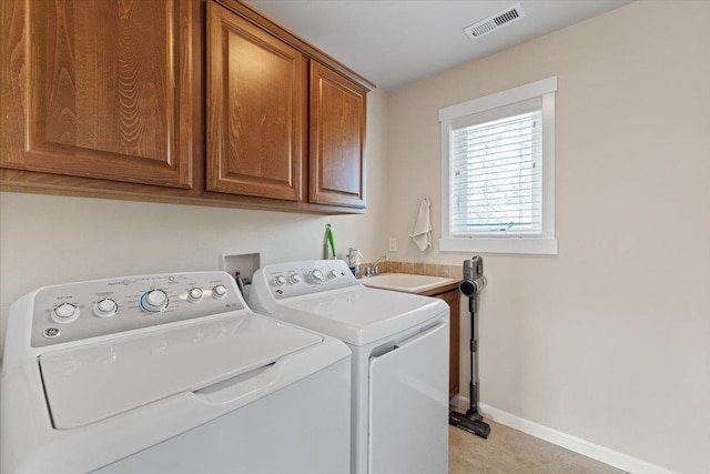 4213 S Cook St, Spokane, WA 99223 - washroom featuring cabinet space and washer and clothes dryer