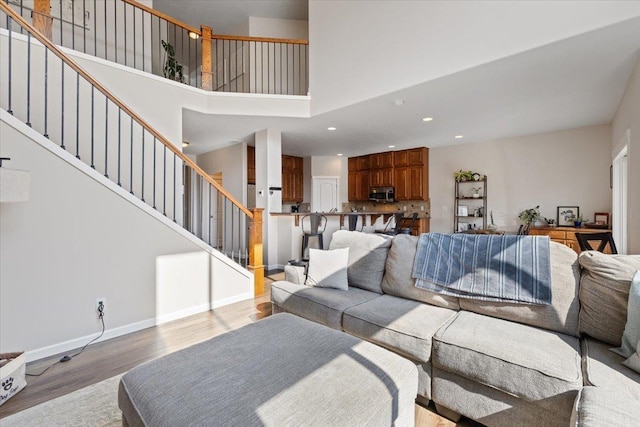 4213 S Cook St, Spokane, WA 99223 - living area with wood finished floors, stairway, recessed lighting, and a towering ceiling