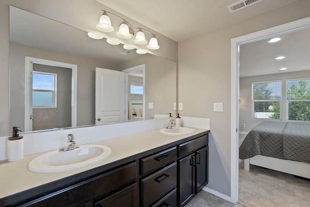 1248 W Staples Rd, Post Falls, ID 83854 - ensuite bathroom with double vanity and plenty of natural light