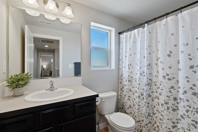 1248 W Staples Rd, Post Falls, ID 83854 - full bathroom featuring vanity and a shower with shower curtain