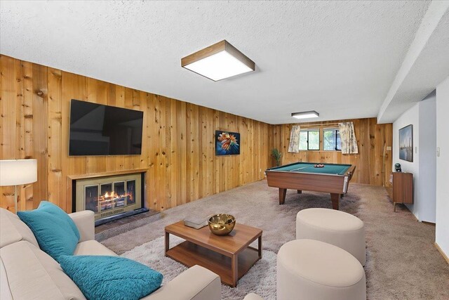 3810 S Moffitt Rd, Spokane Valley, WA 99206 - rec room featuring wooden walls, pool table, carpet, a glass covered fireplace, and a textured ceiling