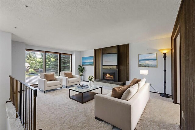 3810 S Moffitt Rd, Spokane Valley, WA 99206 - unfurnished living room featuring light colored carpet, a fireplace, and a textured ceiling