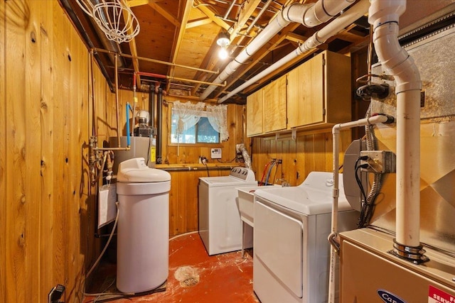 3810 S Moffitt Rd, Spokane Valley, WA 99206 - laundry room with independent washer and dryer, cabinet space, and wood walls