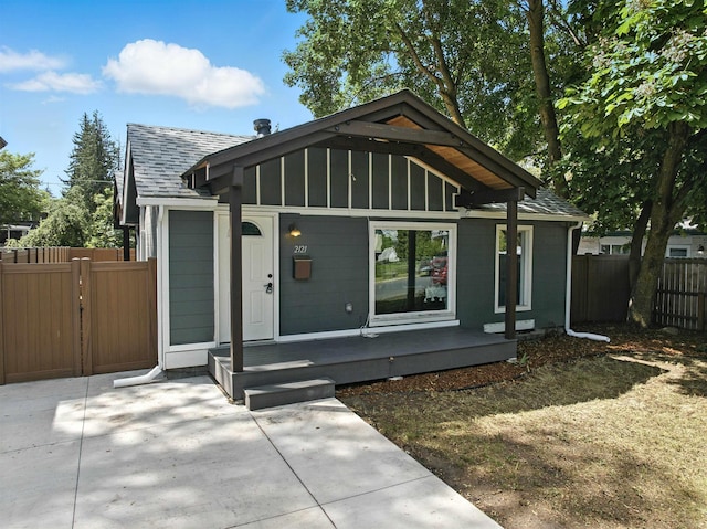 2121 W Cleveland Ave, Spokane, WA 99205 - view of front of property with a shingled roof, covered porch, and board and batten siding