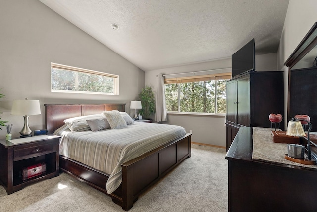 4812 S Wildwood Ln, Spokane, WA 99206 - bedroom featuring light carpet, a textured ceiling, and vaulted ceiling