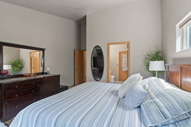 4812 S Wildwood Ln, Spokane, WA 99206 - bedroom with connected bathroom and a textured ceiling