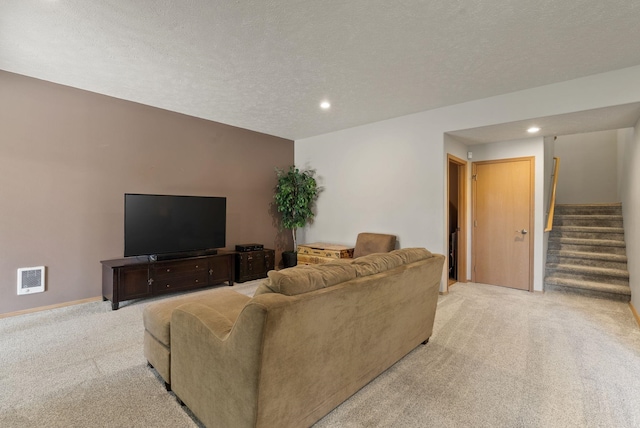 4812 S Wildwood Ln, Spokane, WA 99206 - living area with light colored carpet, stairs, recessed lighting, and a textured ceiling