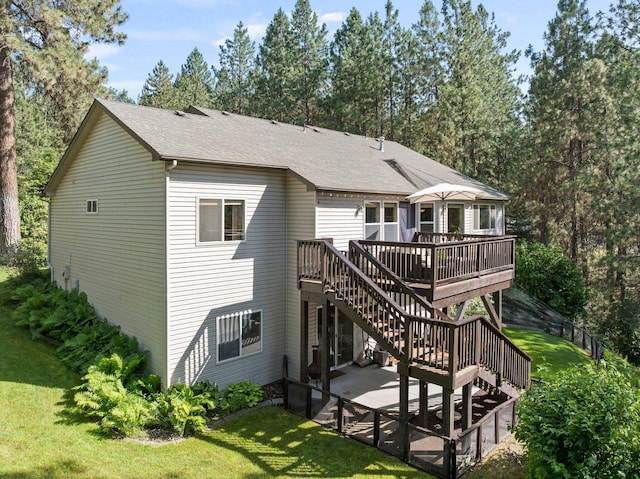 4812 S Wildwood Ln, Spokane, WA 99206 - back of property with stairway, a deck, a lawn, and a shingled roof