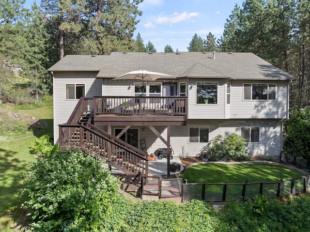 4812 S Wildwood Ln, Spokane, WA 99206 - rear view of house featuring a deck, stairway, a yard, and a shingled roof