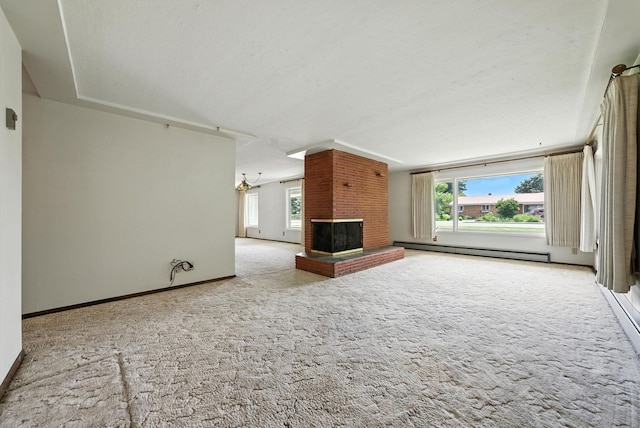 14807 E Broadway Ave, Spokane Valley, WA 99216 - unfurnished living room featuring baseboard heating, carpet flooring, healthy amount of natural light, and a brick fireplace