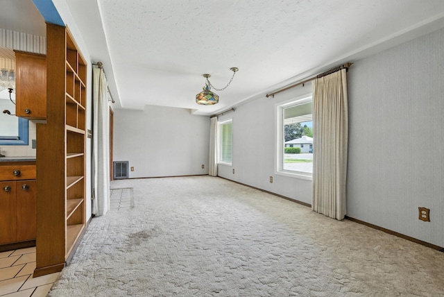 14807 E Broadway Ave, Spokane Valley, WA 99216 - unfurnished living room with light carpet and baseboards