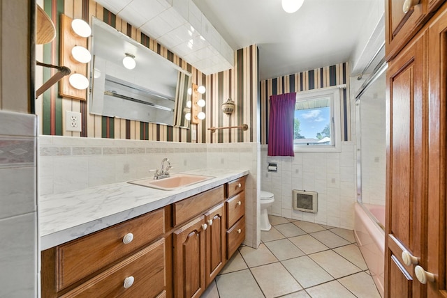 14807 E Broadway Ave, Spokane Valley, WA 99216 - full bath featuring tile walls, wallpapered walls, tile patterned floors, vanity, and bathing tub / shower combination