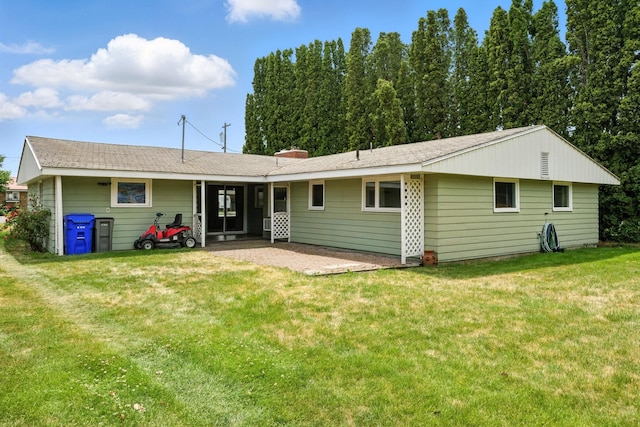 14807 E Broadway Ave, Spokane Valley, WA 99216 - back of house featuring a patio, a lawn, and a shingled roof
