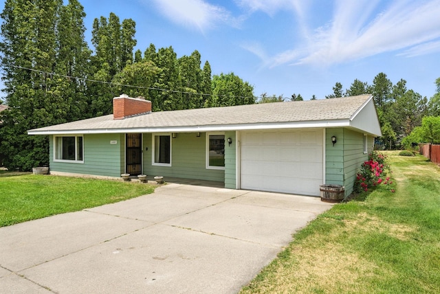 14807 E Broadway Ave, Spokane Valley, WA 99216 - ranch-style house with driveway, a front yard, a chimney, an attached garage, and covered porch