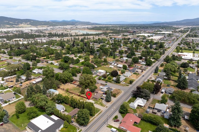 14807 E Broadway Ave, Spokane Valley, WA 99216 - aerial overview of property's location featuring a mountain backdrop and nearby suburban area