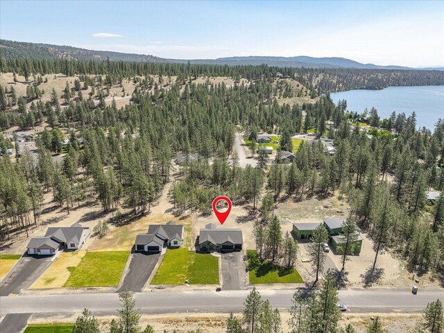 6571 Kate Dr, Nine Mile Falls, WA 99206 - drone / aerial view of a heavily wooded area and a water and mountain view