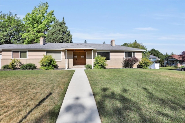 1406 S Cedar St Unit 1408, Spokane, WA 99203 - ranch-style home with a chimney, a front yard, and brick siding