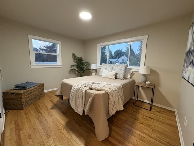1406 S Cedar St Unit 1408, Spokane, WA 99203 - bedroom featuring baseboards and wood finished floors