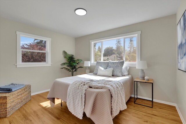 1406 S Cedar St Unit 1408, Spokane, WA 99203 - bedroom with multiple windows and wood finished floors