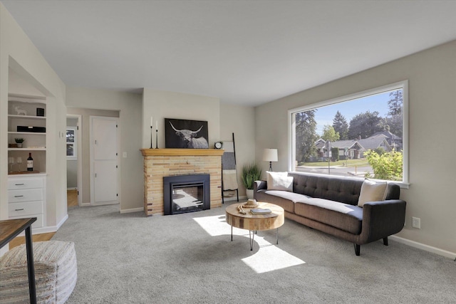 1406 S Cedar St Unit 1408, Spokane, WA 99203 - living area featuring carpet floors and a brick fireplace