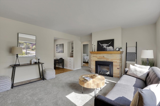 1406 S Cedar St Unit 1408, Spokane, WA 99203 - living room featuring carpet floors and a fireplace